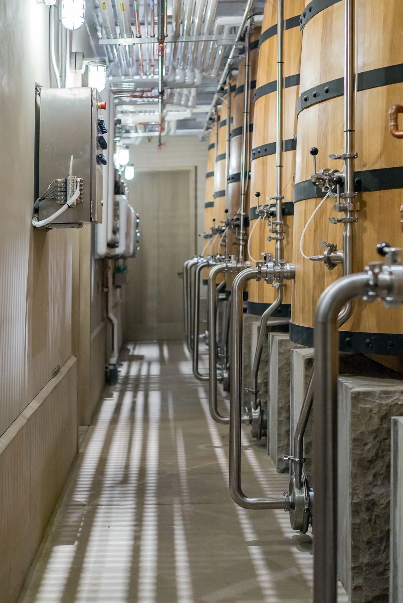 Industrial winery fermentation tanks commercial photography